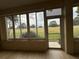 Bright sunroom with view of golf course at 12900 Se 97Th Terrace Rd, Summerfield, FL 34491