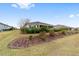 Manicured backyard lawn and landscaping around a screened in lanai for outdoor enjoyment at 8160 Sw 92Nd Cir, Ocala, FL 34481