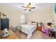 Cozy bedroom with a ceiling fan, natural light, and coordinated furniture at 8160 Sw 92Nd Cir, Ocala, FL 34481