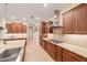 Modern kitchen with custom cabinetry, stainless steel appliances, and granite countertops at 8160 Sw 92Nd Cir, Ocala, FL 34481