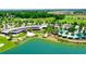 Stunning aerial view of the community's clubhouse, pool, golf course, and a serene lake at 4336 Nw 55Th Ct, Ocala, FL 34482