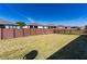 Spacious backyard with a brown brick fence under a clear blue sky at 4336 Nw 55Th Ct, Ocala, FL 34482