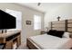 Bedroom with natural light, a neutral color scheme and an entertainment center at 4336 Nw 55Th Ct, Ocala, FL 34482
