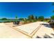 Bocce ball court with seating near lake, providing a serene outdoor recreation spot at 4336 Nw 55Th Ct, Ocala, FL 34482