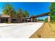 Community entrance with palm trees and a modern covered entryway at 4336 Nw 55Th Ct, Ocala, FL 34482