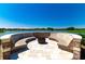 This outdoor fire pit is perfect for entertaining, with a beautiful lake view and seating for everyone at 4336 Nw 55Th Ct, Ocala, FL 34482