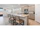 Kitchen island with a granite countertop, stainless steel appliances and seating for four people at 4336 Nw 55Th Ct, Ocala, FL 34482
