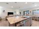 Open concept kitchen flowing to living room, granite countertop and stainless steel appliances at 4336 Nw 55Th Ct, Ocala, FL 34482