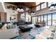 Elegant lounge area with modern furniture, a fireplace, and access to an outdoor patio at 4336 Nw 55Th Ct, Ocala, FL 34482