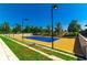 Well-maintained tennis court, perfect for recreational games, set against a backdrop of lush greenery at 4336 Nw 55Th Ct, Ocala, FL 34482