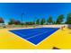 Bright tennis court ready for a match, featuring ample space and surrounded by landscaped grounds at 4336 Nw 55Th Ct, Ocala, FL 34482