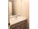 Simple bathroom with vanity and a large mirror at 19728 Sw 83Rd Place Rd # A-1, Dunnellon, FL 34432