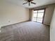 Bedroom with carpet and access to balcony at 19728 Sw 83Rd Place Rd # A-1, Dunnellon, FL 34432