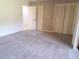 Bright bedroom with double closets and carpet flooring at 19728 Sw 83Rd Place Rd # A-1, Dunnellon, FL 34432