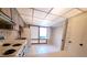 Full view of kitchen with wood cabinets and white appliances at 19728 Sw 83Rd Place Rd # A-1, Dunnellon, FL 34432