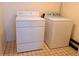 White washer and dryer set in a compact laundry room at 19728 Sw 83Rd Place Rd # A-1, Dunnellon, FL 34432