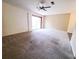 Large living room with carpet and access to patio at 19728 Sw 83Rd Place Rd # A-1, Dunnellon, FL 34432