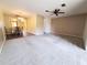 Spacious living room featuring carpet and sliding glass doors at 19728 Sw 83Rd Place Rd # A-1, Dunnellon, FL 34432