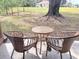 Relaxing patio area with wicker chairs and table at 19728 Sw 83Rd Place Rd # A-1, Dunnellon, FL 34432