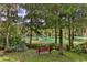 Scenic river view with lush greenery and a relaxing bench at 19728 Sw 83Rd Place Rd # A-1, Dunnellon, FL 34432