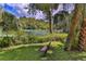 Serene view of the river with a peaceful bench at 19728 Sw 83Rd Place Rd # A-1, Dunnellon, FL 34432