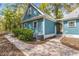 Side view of the house with a brick walkway at 7629 Sw 188 Ave, Dunnellon, FL 34432