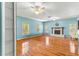 Bright living room with hardwood floors and fireplace at 7629 Sw 188 Ave, Dunnellon, FL 34432