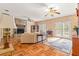 Spacious living room with stone fireplace and hardwood floors at 7629 Sw 188 Ave, Dunnellon, FL 34432