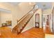 Wooden staircase with ornate railing in entryway at 7629 Sw 188 Ave, Dunnellon, FL 34432