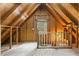 Unfinished attic space with wood framing, window, and flooring at 7629 Sw 188 Ave, Dunnellon, FL 34432