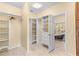 Large walk-in closet with built-in shelving and drawers at 7629 Sw 188 Ave, Dunnellon, FL 34432