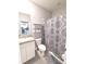 Simple bathroom with shower/tub combo, toilet and white vanity at 8923 Sw 50Th Ave, Ocala, FL 34476