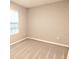 Simple bedroom with neutral walls and carpeted floor at 8923 Sw 50Th Ave, Ocala, FL 34476