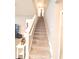 Carpeted staircase leading to the second floor at 8923 Sw 50Th Ave, Ocala, FL 34476