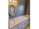 Bathroom with a modern sink, countertop, and cabinet and a large mirror at 9951 Sw 62Nd Ter, Ocala, FL 34476