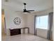Bedroom featuring laminate floors, a ceiling fan, and a large window at 9951 Sw 62Nd Ter, Ocala, FL 34476