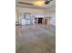 Functional garage space equipped with storage cabinets, water heater, and room for multiple bins at 9951 Sw 62Nd Ter, Ocala, FL 34476
