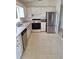 Functional kitchen featuring stainless steel appliances and white cabinetry at 9951 Sw 62Nd Ter, Ocala, FL 34476