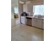 Kitchen with stainless steel dishwasher, microwave, and sink at 9951 Sw 62Nd Ter, Ocala, FL 34476