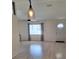Living room featuring a ceiling fan and light-colored floors at 9951 Sw 62Nd Ter, Ocala, FL 34476