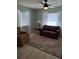 Cozy living room featuring natural light, plush seating, and a stylish area rug at 9951 Sw 62Nd Ter, Ocala, FL 34476