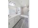 Modern bathroom with double sink vanity, tiled shower, and sleek fixtures for a luxurious feel at 13026 Ne 6 Pl, Silver Springs, FL 34488