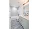Well-lit bathroom featuring a shower-tub combination, a sleek vanity, and modern fixtures at 13026 Ne 6 Pl, Silver Springs, FL 34488