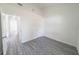 Spacious bedroom with gray wood-look floors offering a bright and airy atmosphere at 13026 Ne 6 Pl, Silver Springs, FL 34488