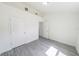 Bedroom featuring a closet and modern gray wood-look floors at 13026 Ne 6 Pl, Silver Springs, FL 34488
