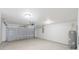 Spacious garage with an automatic door opener and a water heater at 13026 Ne 6 Pl, Silver Springs, FL 34488