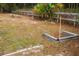 Community horseshoe pit area with wood beam frames and well-maintained grassy surroundings at 13026 Ne 6 Pl, Silver Springs, FL 34488