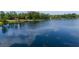 Scenic view of a serene lake with lush greenery along the shoreline at 13026 Ne 6 Pl, Silver Springs, FL 34488