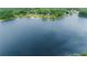 Scenic view of a serene lake surrounded by lush greenery and natural landscapes at 13026 Ne 6 Pl, Silver Springs, FL 34488