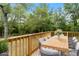 Outdoor dining space on the deck with a wooded view at 8975 Sw 202Nd Avenue Rd, Dunnellon, FL 34431